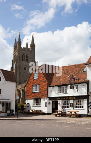 Tenterden Kent England UK The Woolpack hotel 15th century pub exterior and St Mildred s Parish Church clock tower Stock Photo