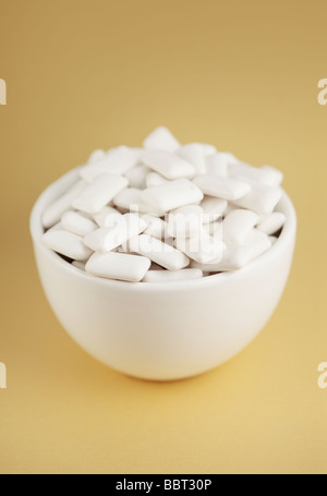 White rectangular chewing gum in a small white bowl Stock Photo