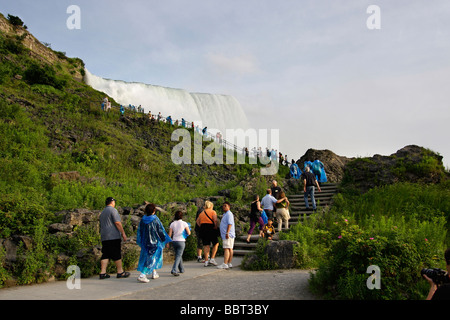Edge of Niagara falls waterfall with people in New York NY State Park USA low angle from below Impressive hi-res Stock Photo