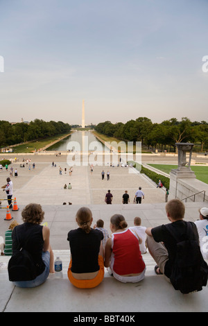 Visitors looking at the Washington Memorial and the Reflecting Pool from the steps of the Lincoln Memorial, Washington DC, USA Stock Photo