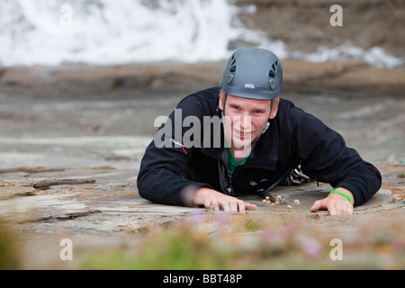 Climbers on a sea cliff climb on Baggy Point near Croyde in north Devon UK Stock Photo
