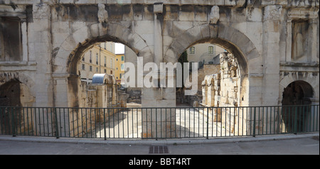 Ancient roman city gate Nimes Porta Augusta Languedoc-Rousillon France Stock Photo