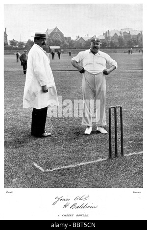 Harry Baldwin 1899 photo of a Cheery Bowler for Hampshire County Cricket Club from 1877 1905 pulling up his trousers Stock Photo