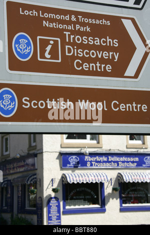 Village of Aberfoyle, Scotland. Tourist direction signs on Main Street of the picturesque Scottish tourist village of Aberfoyle.