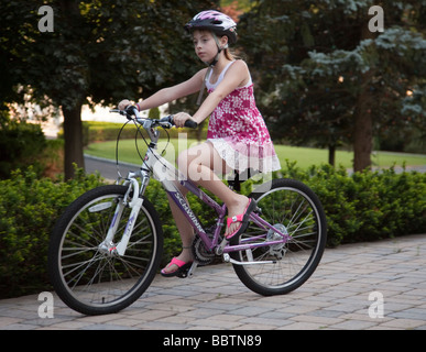 Young girl riding a bicycle Stock Photo