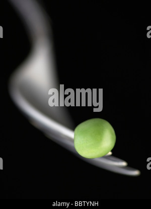Fresh Pea on a fork close up Stock Photo