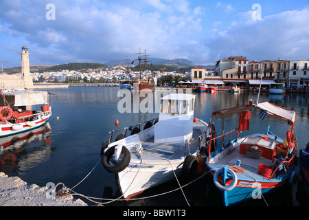 Boats tied up in the Venetian Harbour at Rethymnon, Crete, Greece, late on a summer afternoon Stock Photo