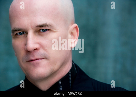 Bald man in his late 40's wearing a dark suit. Stock Photo