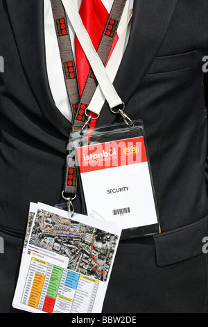 Identification card and a map on the chest of a security man in a dark suit, Sultanhamet, Istanbul, Turkey Stock Photo