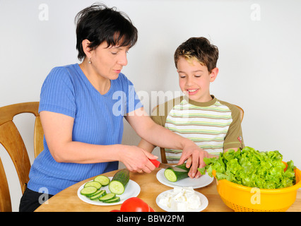 Mother and son making a salad Stock Photo