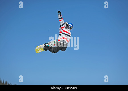 Snowboarder performs a big air in the terrain park. Brighton Ski Resort, Salt Lake City, Utah, USA Stock Photo