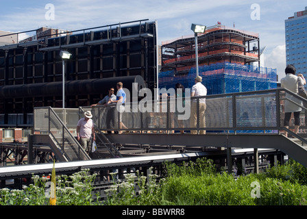 Visitors leave at the West 20th street entrance exit of the new High Line Park in the New York neighborhood of Chelsea Stock Photo