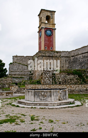 The red bricked clock and bell tower protected behind high walls inside the Old Fortress, Corfu Town Stock Photo