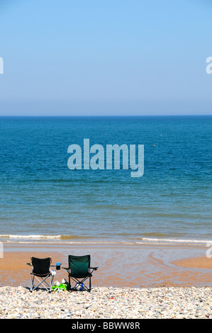 Empty chairs on beach at Llandudno, North Wales, UK Stock Photo