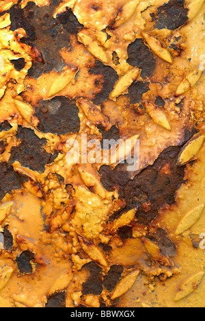 Rusted metallic diamond plate sheet metal. Stock Photo