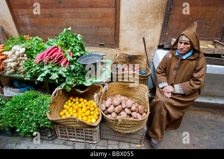 Morroccan Vegetable Vendor Wearing Hoodie in Fez Morrocco Stock Photo