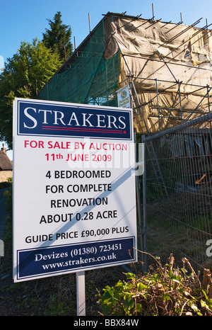 Old derelict cottage for sale in an English Wiltshire village Stock Photo