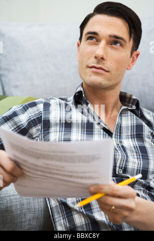 A man holding a piece of paper in his hand Sweden. Stock Photo