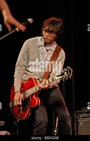 Playing guitar stage. Indonesian Jazz band Mocca and their lead guitarist performing on stage at the Hua Hin jazz festival 2009 Thailand S.E. Asia Stock Photo