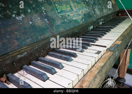 Old, broken and abandoned piano Stock Photo