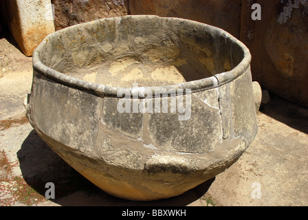 Stone bowl at the Tarxien Temples which is a UNESCO World Heritage site & a archaeological complex in Tarxien on the Mediterranean island of  Malta Stock Photo