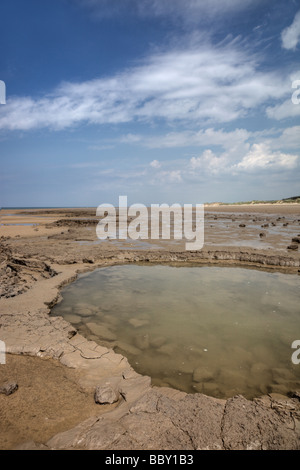 Ancient footprints in silt layers at Formby Stock Photo