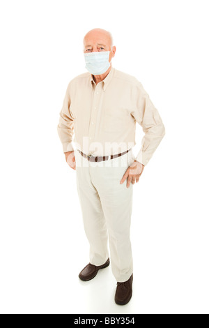 Senior man wearing a face mask to protect himself from an epidemic Full body isolated  Stock Photo