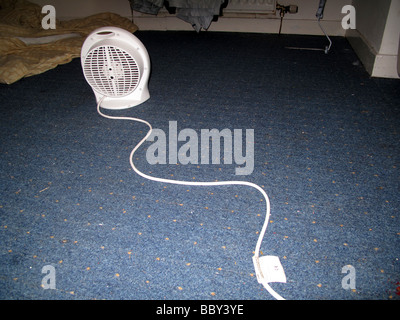 Portable lectric fan heater on floor with cable Stock Photo