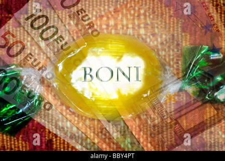 Candy with the words 'bonuses' and bank notes, symbolic image for bonus payments to managers Stock Photo