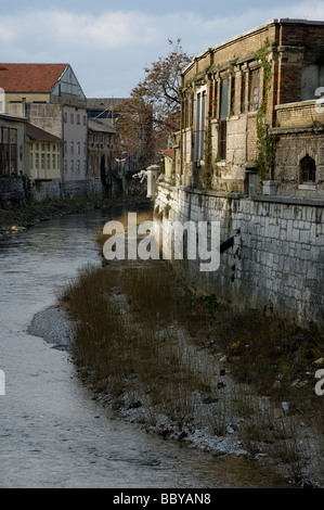 Polluted river channel of Rjecina passing through industrial part of Rijeka city Stock Photo