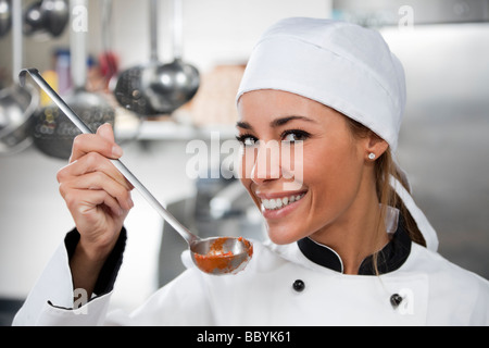 female chef looking at camera and smiling Stock Photo