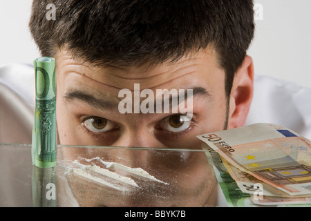 Guy smelling drug on the white background Stock Photo