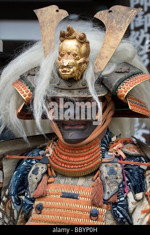 Man dressed in full samurai armor complete with kabuto helmet and mempo face mask to intimidate the enemy Stock Photo