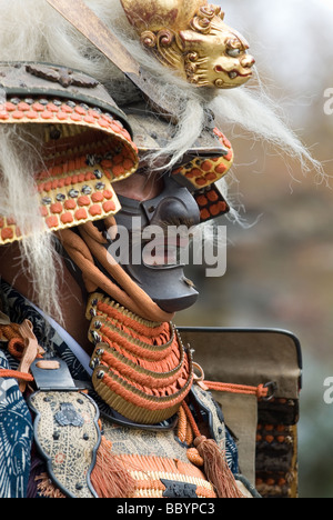 Man dressed in full samurai armor complete with kabuto helmet and mempo face mask to intimidate the enemy Stock Photo