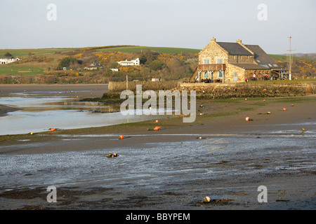 Town of Newport Parrog, Wales. Sunny evening view of Newport Boat Club at the mouth of the River Nevern, during low tide. Stock Photo