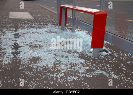 shattered glass lying on the ground from a vandalised bus shelter in northern ireland