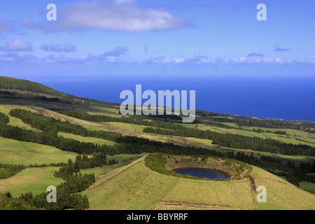 Landscape of a crater with a Lake and the sea on the background Canário s Lake Sao Miguel Island Azores Portugal Stock Photo