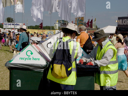 people using recycling bins at Womad Festival England Stock Photo