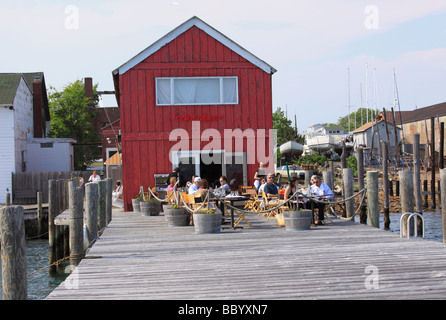 Outdoor dining on the pier at the Scrimshaw Restaurant Greenport Long Island NY USA Stock Photo