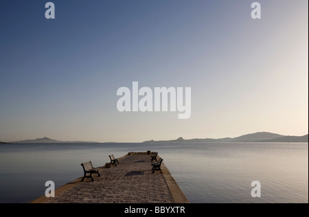 Jetty with benches at dawn Cannigione Sardinia Stock Photo