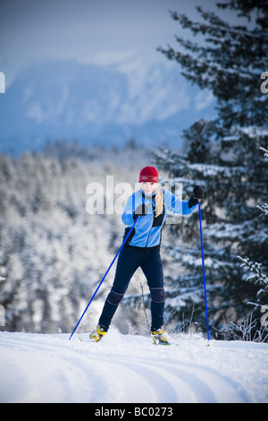 A young woman cross-country skiing. Stock Photo