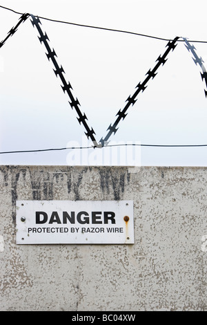 Anti Vandal razor wire sign Stock Photo