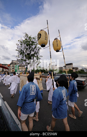 Yamaboko Junko Parade crossing Kamo river and entering to Gion district. Gion Matsuri Festival. Kyoto. Japan Stock Photo