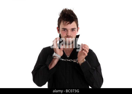 Twenty year old young man in handcuffs Stock Photo