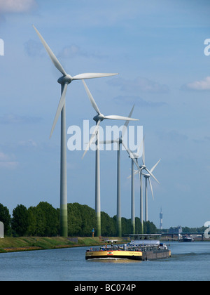 Line of modern windmills wind turbines in the Rotterdam port area Zuid Holland the Netherlands Stock Photo