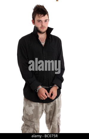 Twenty year old young man in police handcuffs Stock Photo