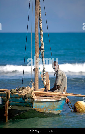 Haiti, Nord, Cap Haitien. Local fisherman and boat, Cormier Plage. Stock Photo