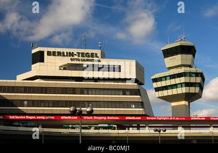 Control tower and main building with publicity for the airline Air Berlin of the Airport Otto Lilienthal Berlin Tegel Germany Stock Photo