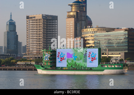 A boat with a big advertising screen on the Huangpu river Shanghai China Stock Photo