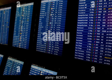 Close up of airline flight departure screens, departure boards, in airport terminal Stock Photo